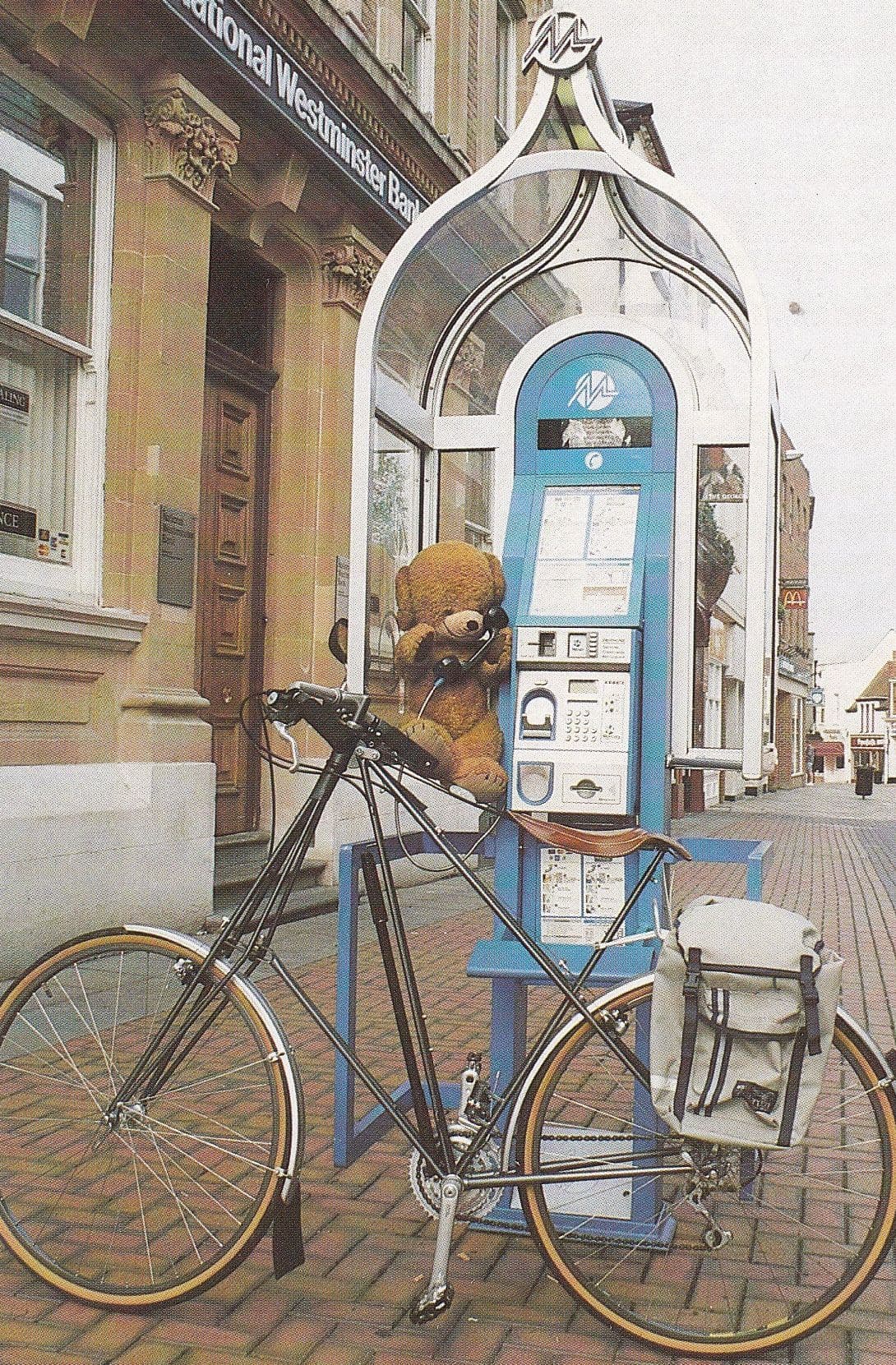 Teddy Bear at Natwest Bank Mercury Telephone Box Bicycle Postcard