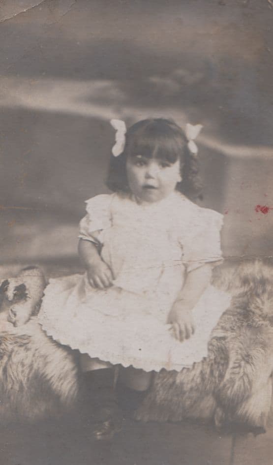 Baby Girl With Ribbons Like Cow Udders Toy Dog Antique Postcard