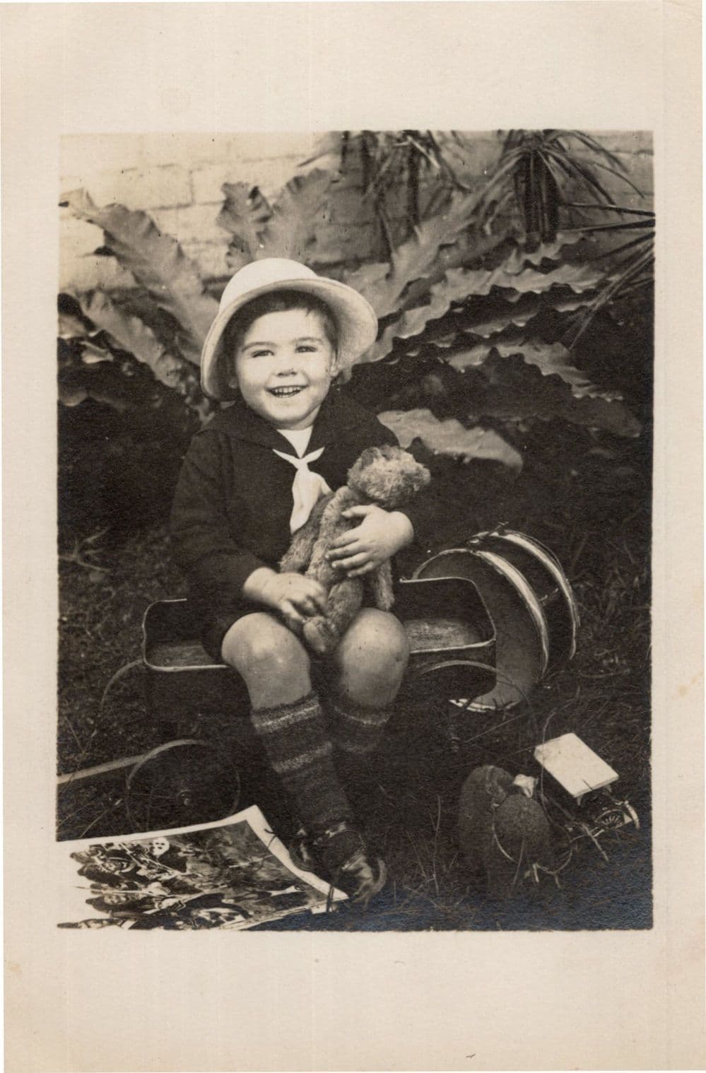 Child Laughing at Military Picture Toy Hat Old Drum Transport Truck Kodak Postcard
