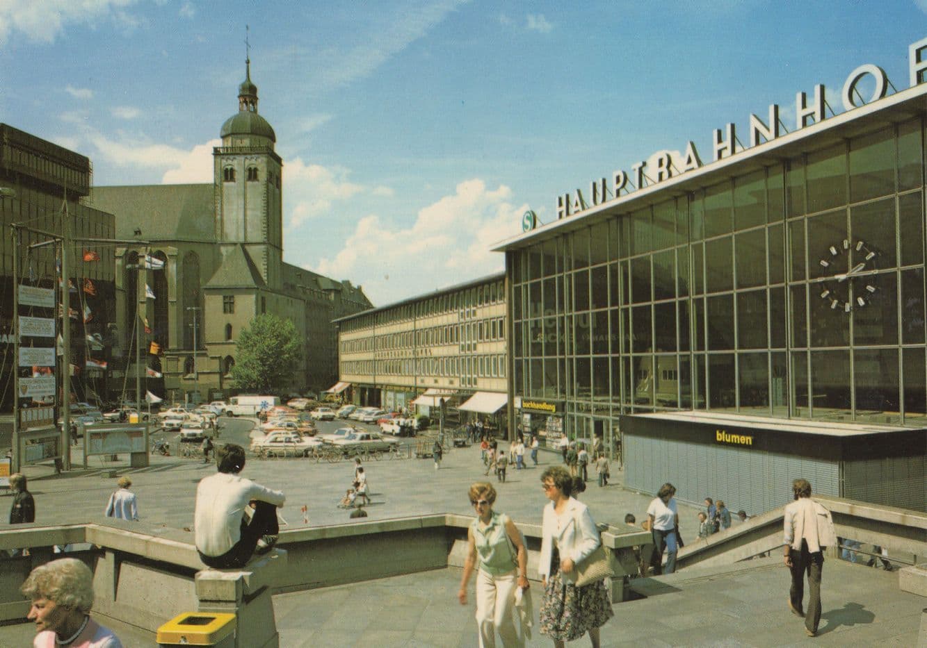 Man Sitting On Wall Flags at Koln Hauptbanhof German Postcard