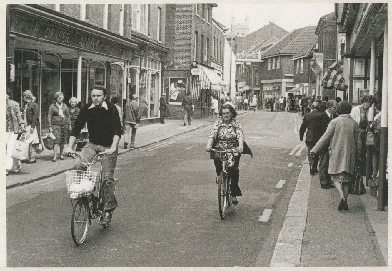 Dereham High Street Drapers 1976 Norwich Norfolk Cyclist Postcard