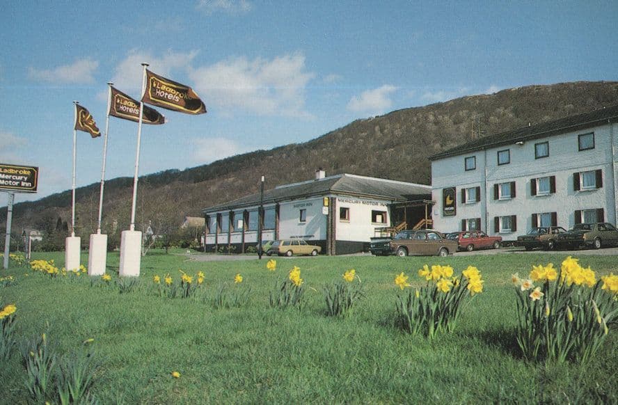 Flags at Ladbroke Mercury Motor Inn Fort Wiliam Scottish Postcard
