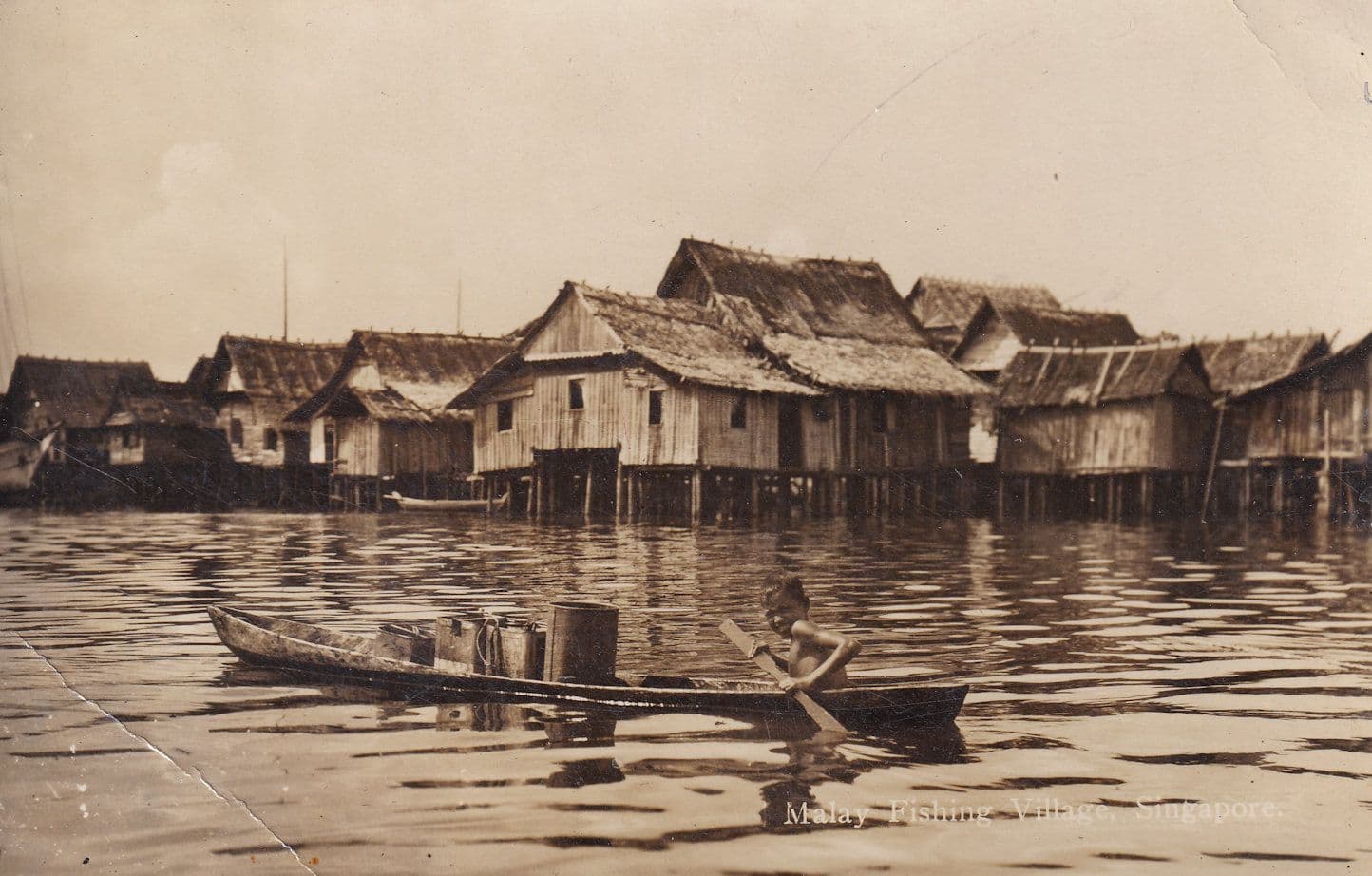 Malaya Fisherman Rowing Boat in Malay Fishing Village Old Real Photo Postcard