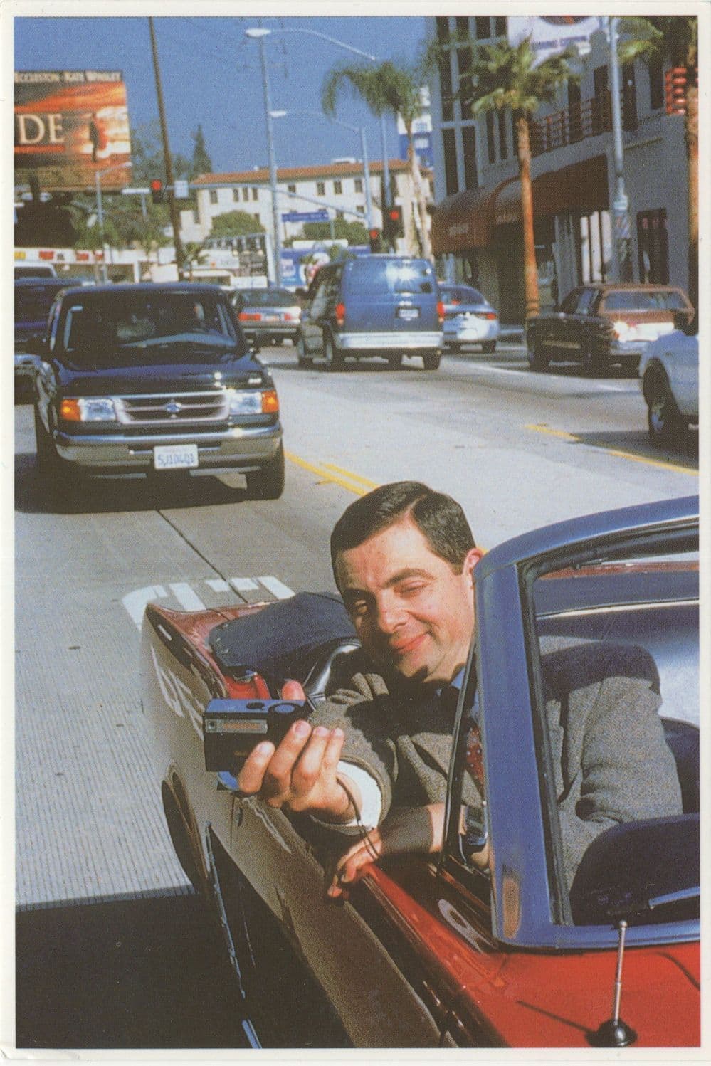 Mr Bean With 1990s Camera in Sports Car Comic Postcard