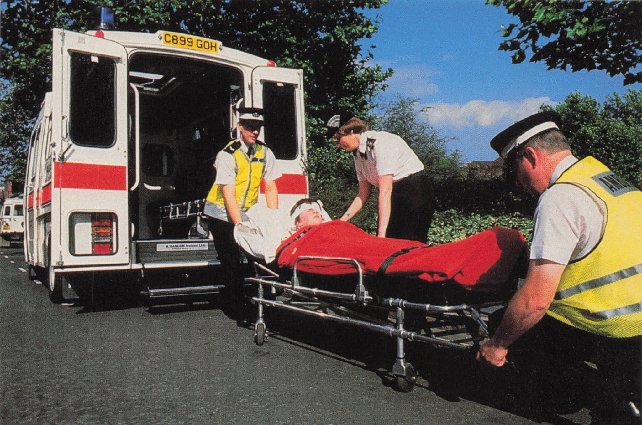 St Johns Ambulance Head Injury Patient On Stretcher 1990s Postcard